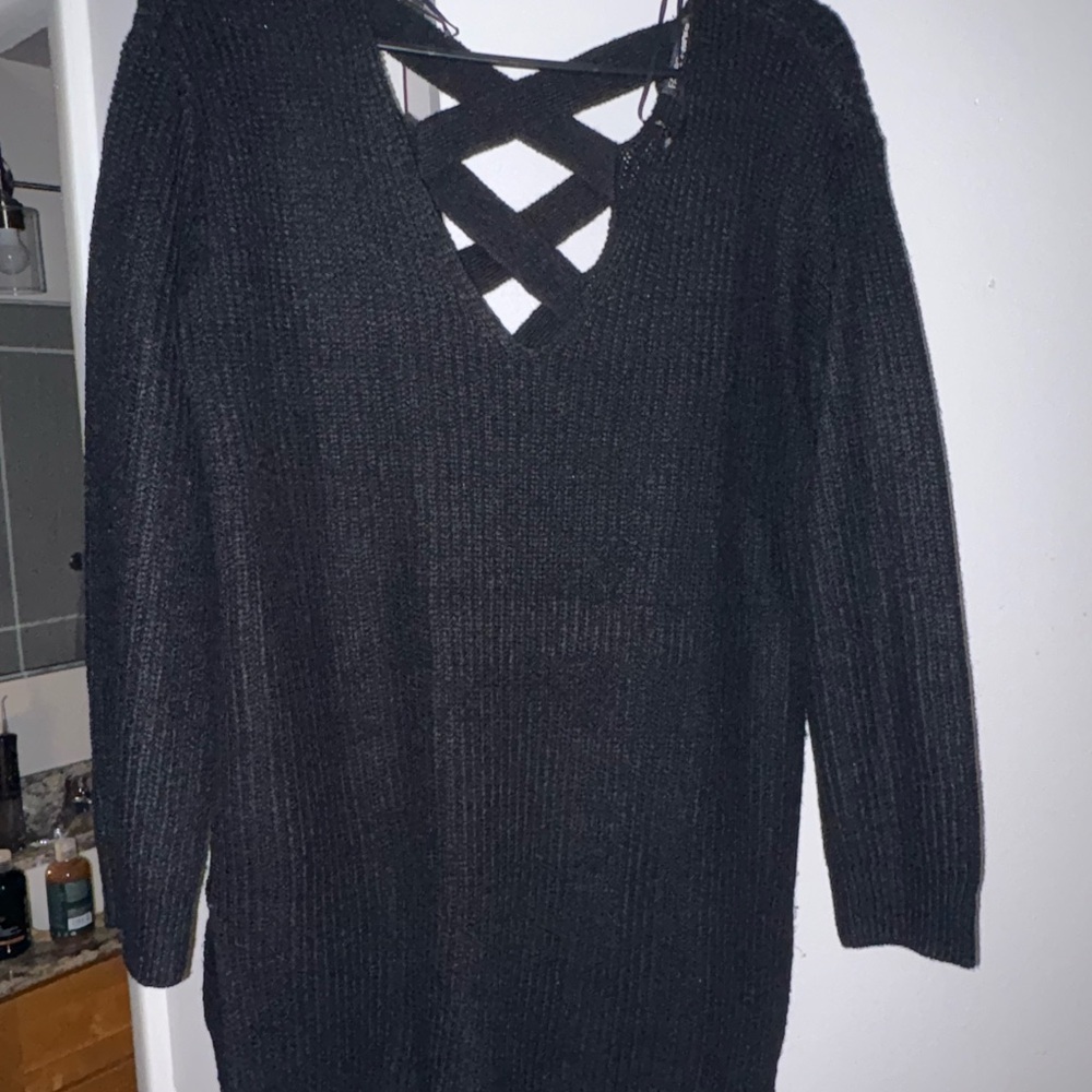 Mixture of sweaters and cardigans.